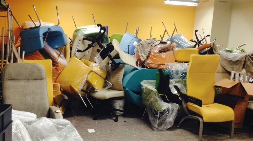 Discarded healthcare furniture illustrating premature upholstery failure and material waste