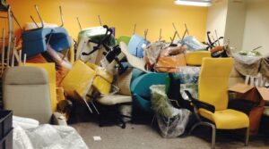 Discarded healthcare furniture illustrating premature upholstery failure and material waste